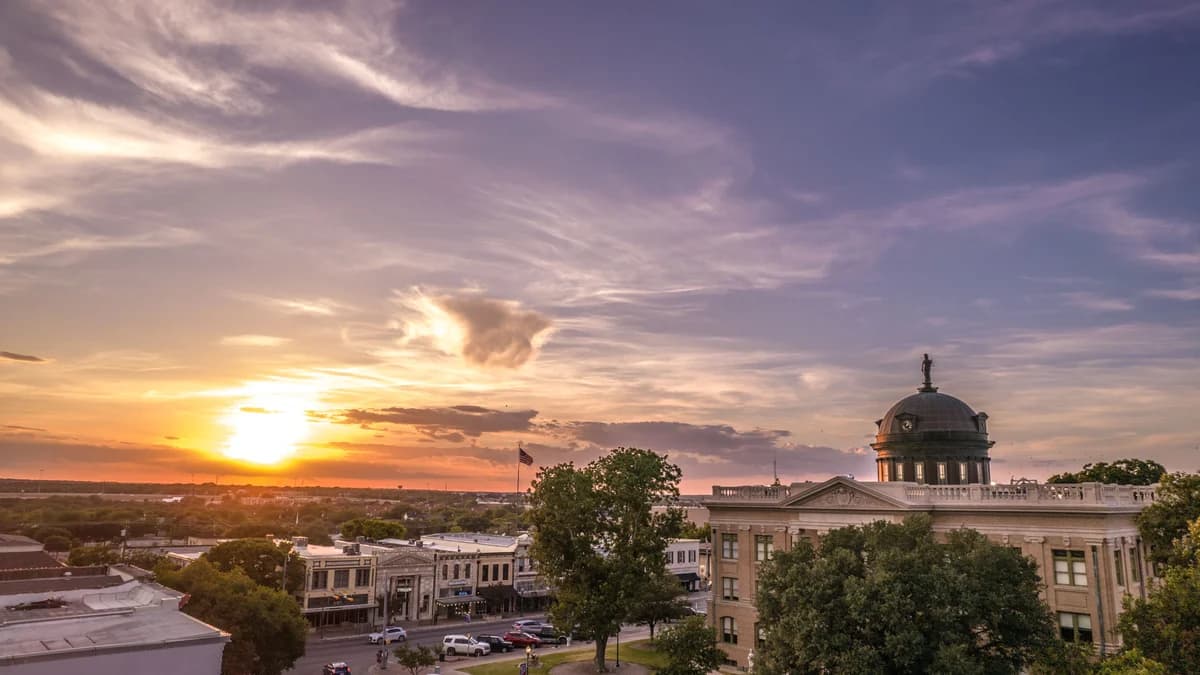 The Williamson County Courthouse and downtown Georgetown square at sunset